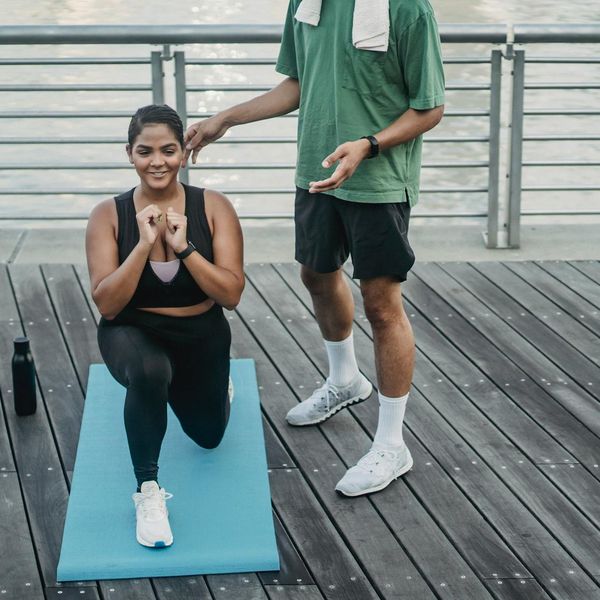 Person in a state of calm balance after a cardio session, sunlight streaming in.